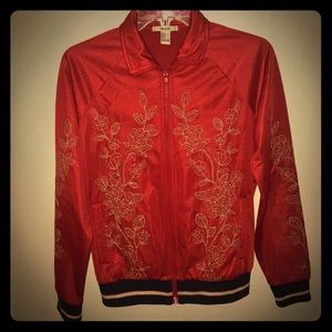 Red polyester jacket with gold floral designs